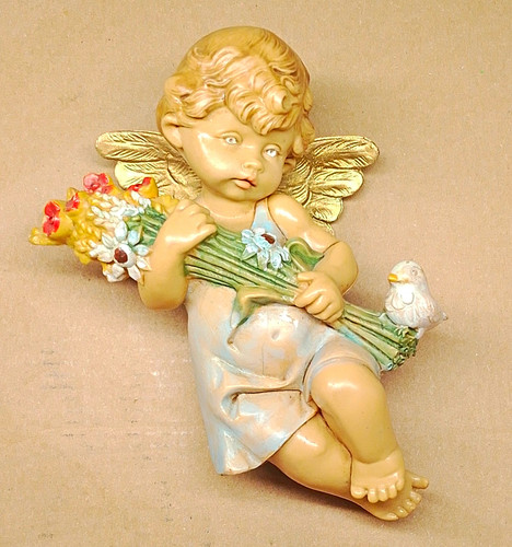 Engel figur sitzend mit - sitzend, blumen